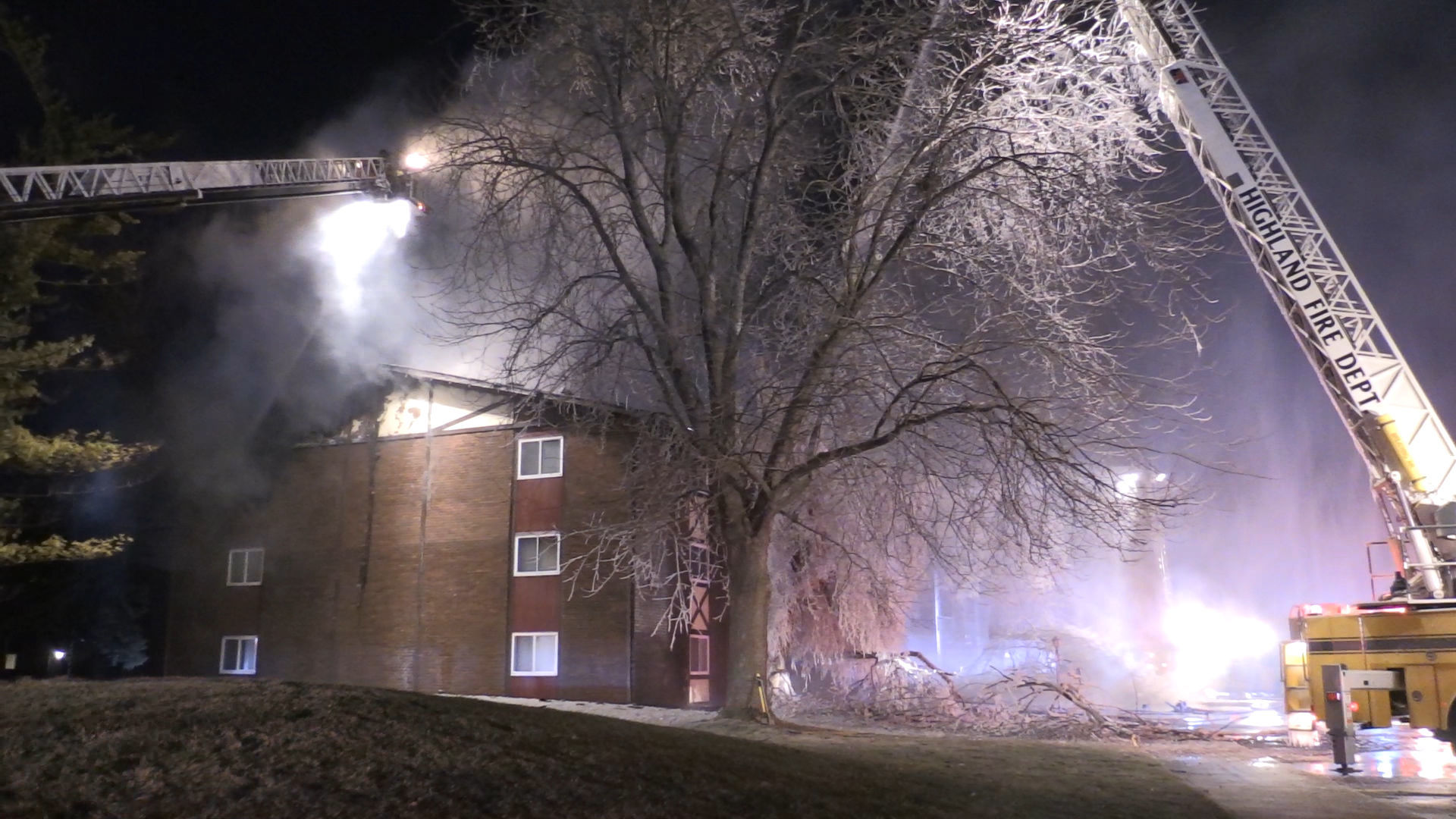 Firefighters continue to battle apartment building fire